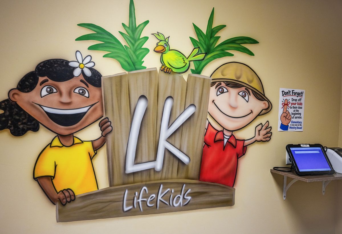 The LifeKids mural and check-in station